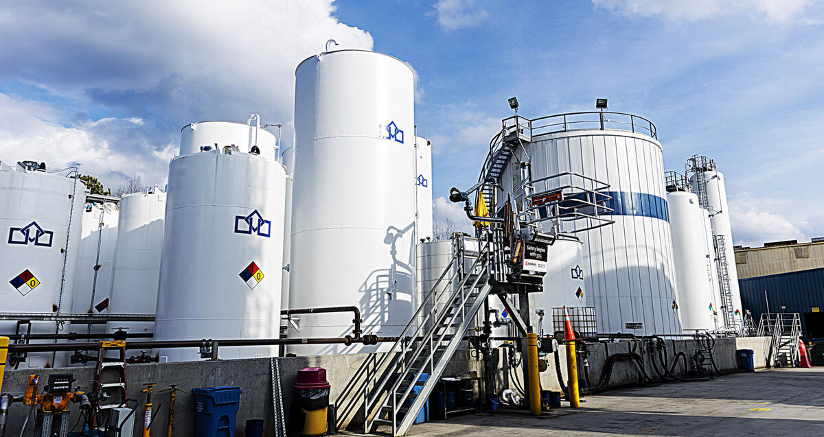 Storage tanks and safety walkways at a UES facility