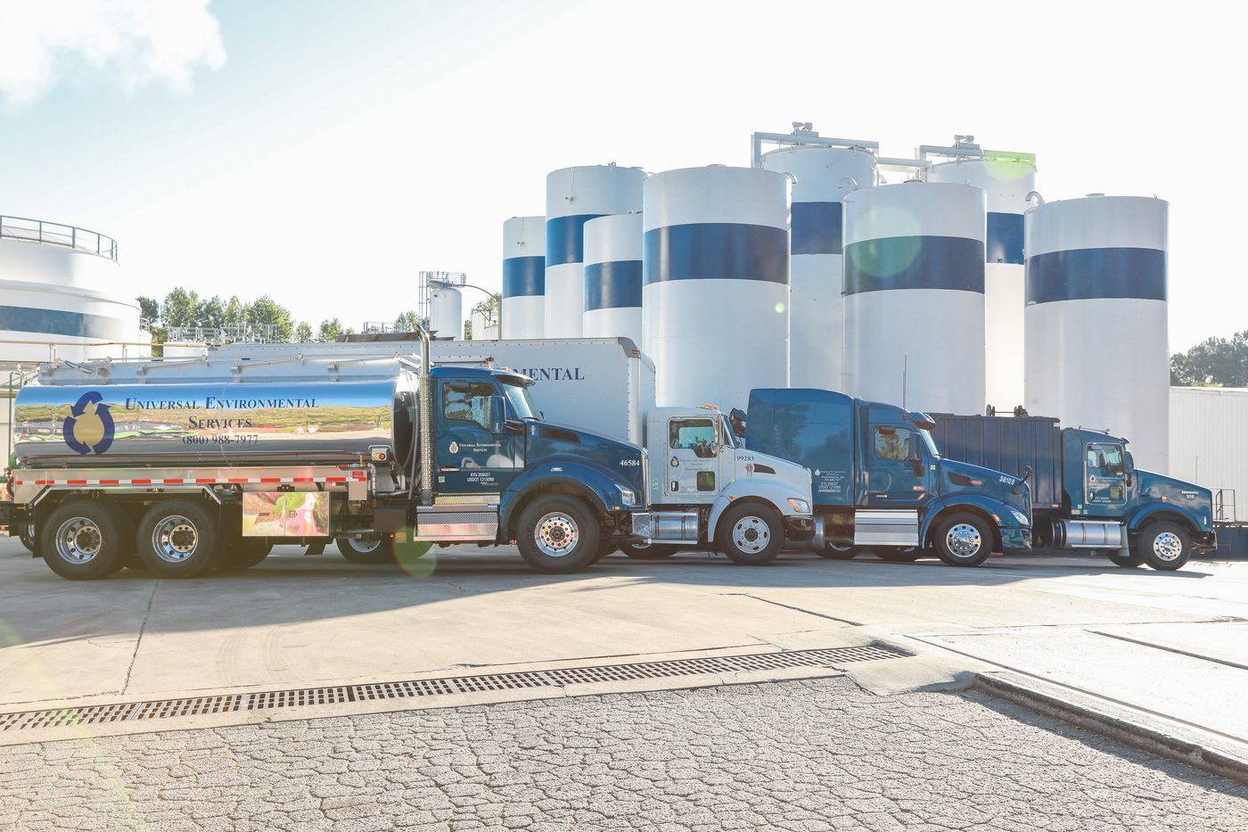 UES tanker trucks lined up in front of storage tanks