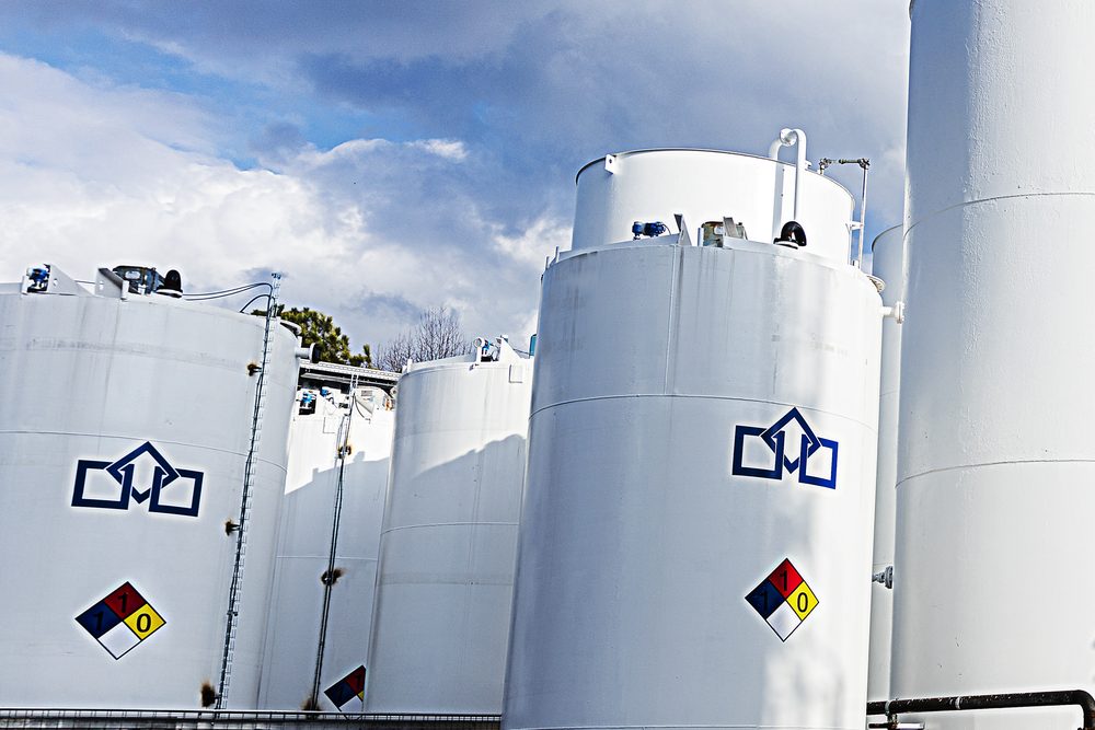 Storage tanks marked with NFPA hazard placards at the UES facility in Peachtree City, Georgia